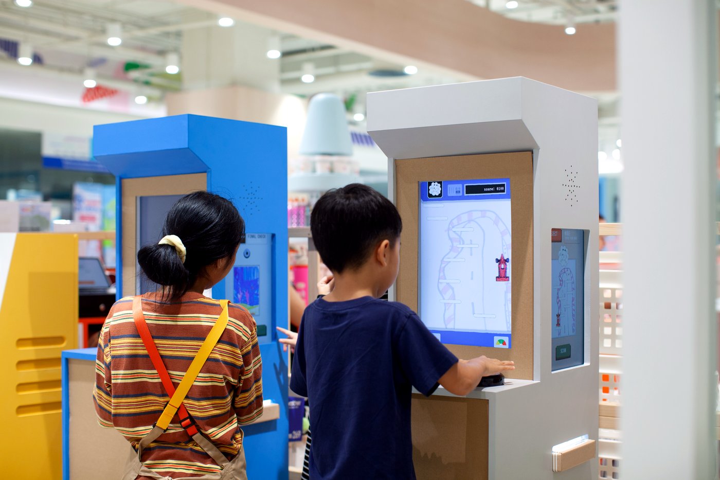 Children playing the games they made at the Gametory Arcade stations, CentralWorld